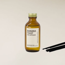 Banana Toast fragranced diffuser in amber bottle with reed sticks