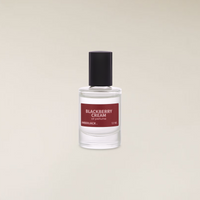 Clear 12ml glass perfume oil bottle with a black cap and a red label for Blackberry Cream.