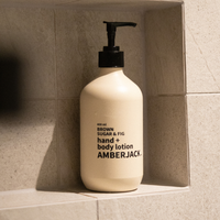 400ml Amberjack Brown Sugar & Fig hand and body lotion in a light beige recycled plastic bottle with a black pump.