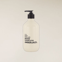 400ml Amberjack Brown Sugar & Fig hand + body wash in a light beige recycled bottle with a black pump.