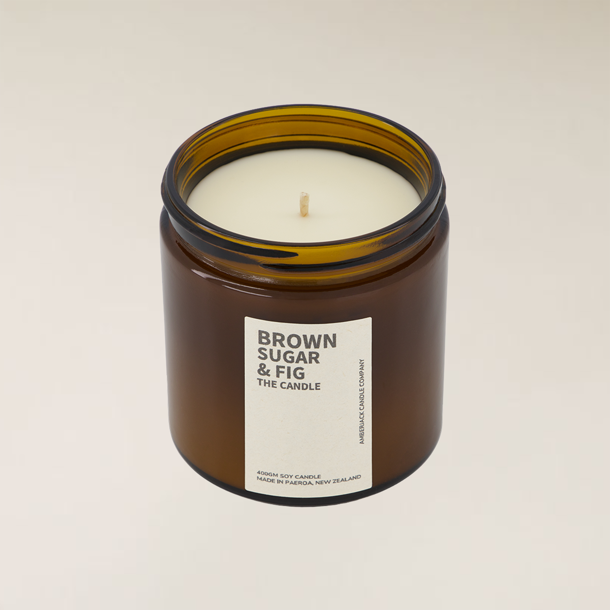 Brown Sugar & Fig 400gm soy candle in a dark amber glass jar with a white label.