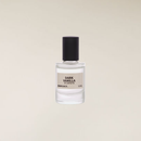 Clear glass 12ml roll-on perfume oil bottle with a black cap and a beige "Dark Vanilla" label.