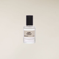 Clear glass 12ml roll-on perfume oil bottle with a black cap and a beige "Dark Vanilla" label.