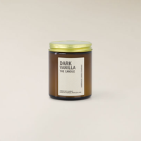 Dark Vanilla 150gm soy candle in an amber glass jar with a gold lid and cream label.