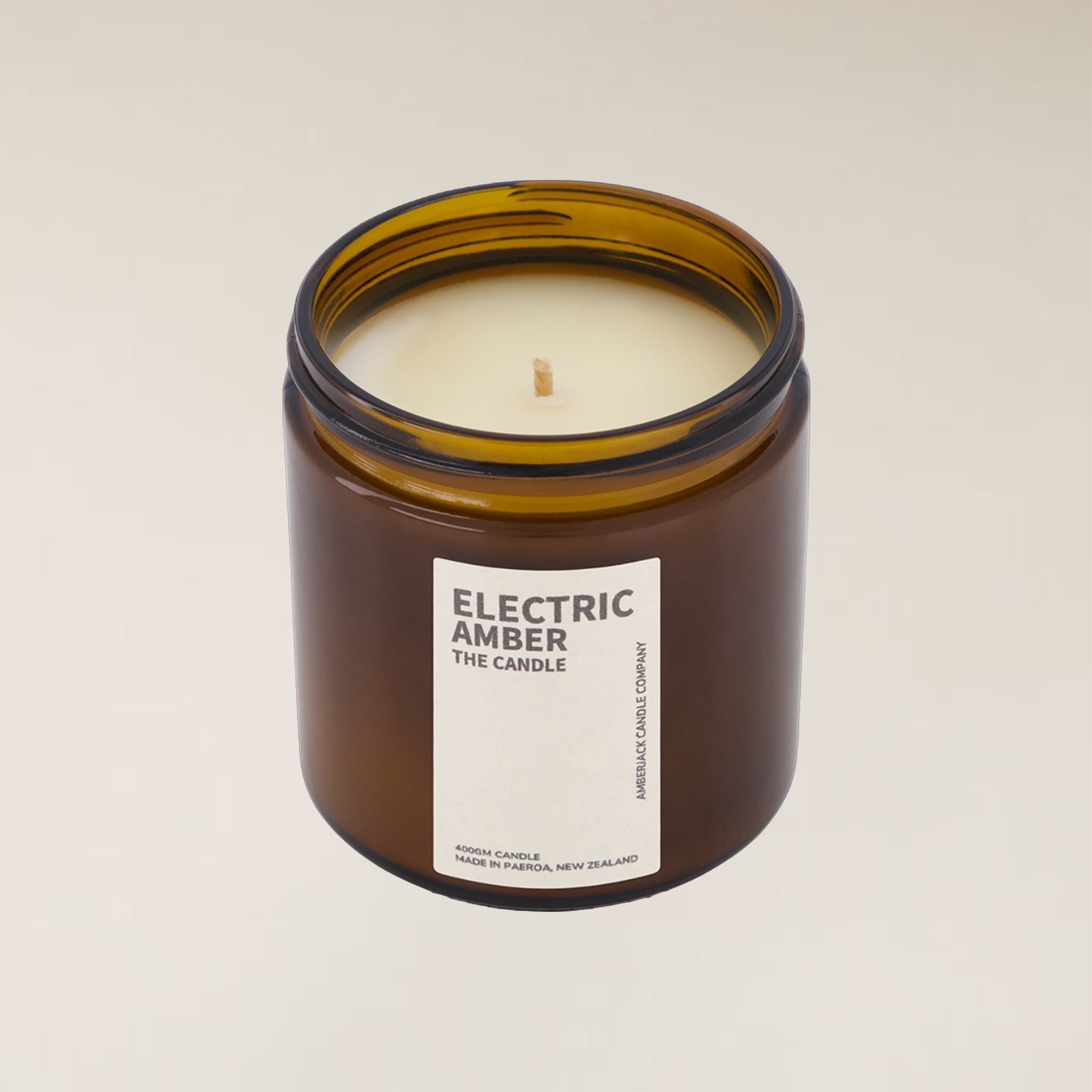 Electric Amber soy candle in a brown glass jar with a white label, 400gm size.