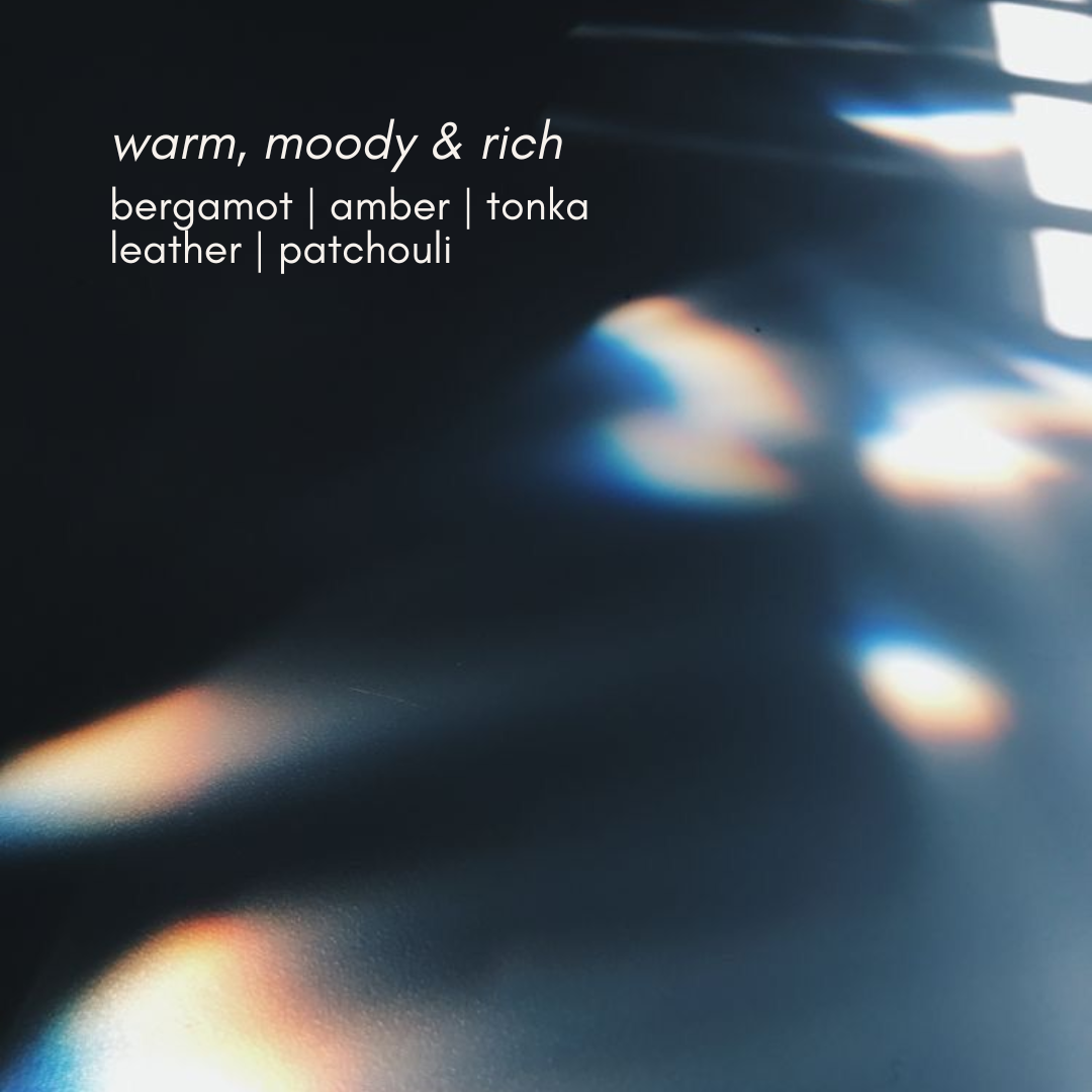 Text overlay on a blurred background with warm, moody, and rich scents.