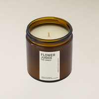 Amber brown glass jar "Flower Junkie" 400gm soy candle with a single wick on a light background.