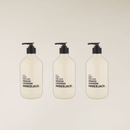 Three 400ml off-white Amberjack hand + body wash bottles with black pumps, "Smoked Lavender" label.