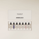 Amberjack Perfume Discovery Set with 7 clear 2.5ml sample vials in a white box.