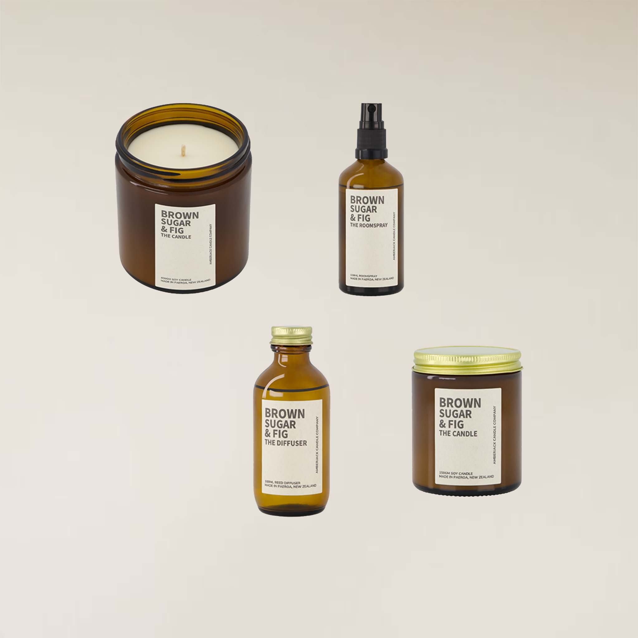 Four amber glass "Brown Sugar & Fig" fragrance products: a regular candle, large candle, room spray, and reed diffuser.