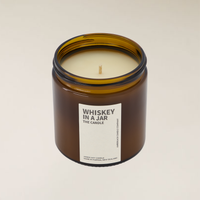 400gm Whiskey in a Jar soy candle in an amber glass jar with a white label.