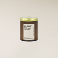 150gm Whiskey in a Jar soy candle in a brown glass jar with a gold lid and cream label.
