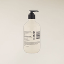 White Sandalwood 400ml hand and body lotion in a light beige recycled bottle with a black pump.