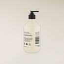 White Sandalwood Hand & Body Wash in a 400ml light beige recycled bottle with a black pump.