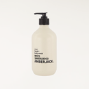 White sandalwood fragranced hand and body wash in a beige recycled bottle