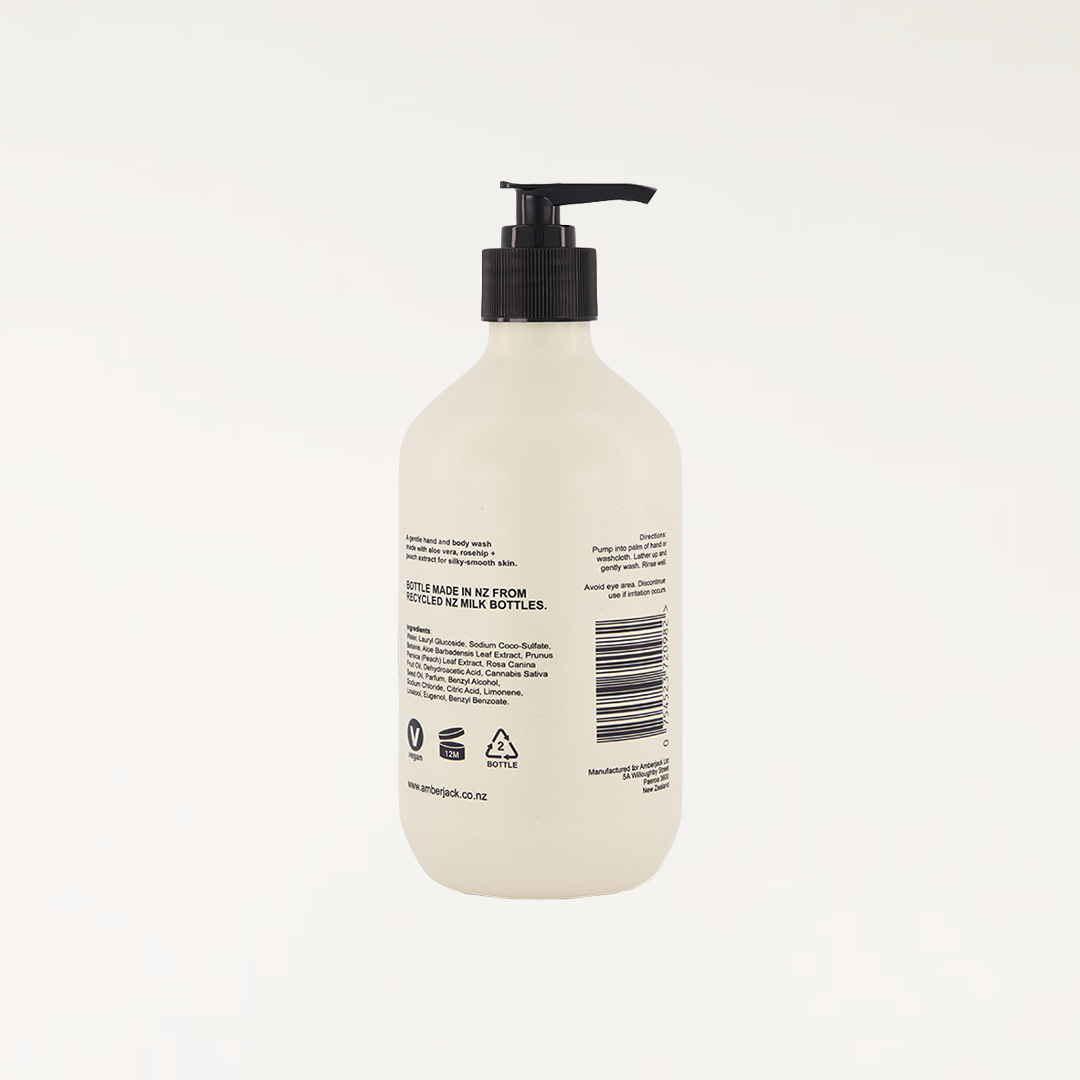White sandalwood fragranced hand and body wash in a beige recycled bottle